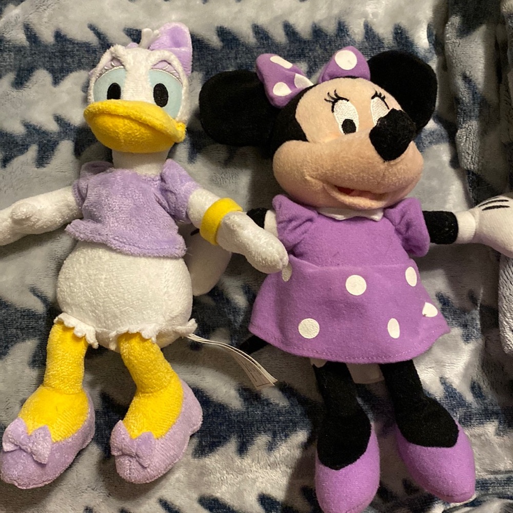 Daphne duck and Minnie Mouse plushies.